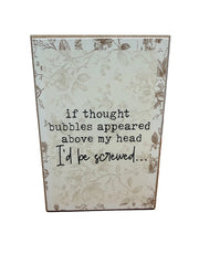 Floral wood sign joking about thought bubbles