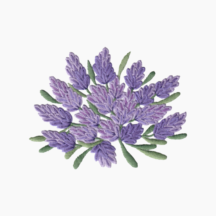 Hand embroidered cotton towel with design of lavender flowers on a white background