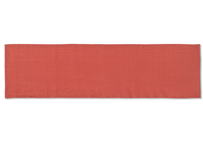 A linen table runner in the color brick