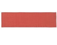 A linen table runner in the color brick