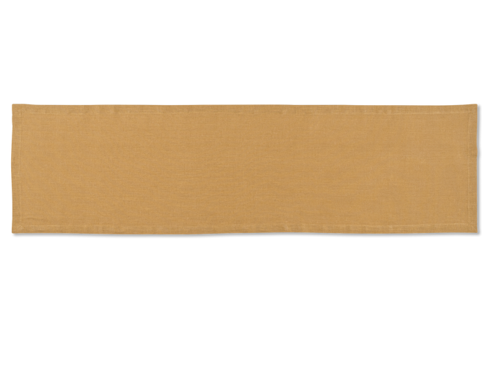 A linen table runner in the color curry